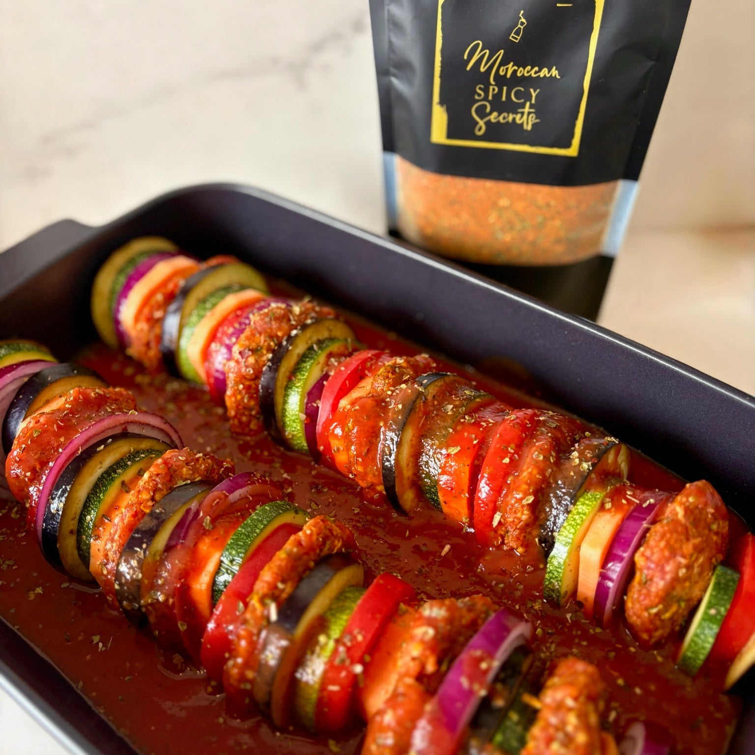 Ovenschotel met kefta, groenten en tomatensaus van Moroccan Spicy Secrets