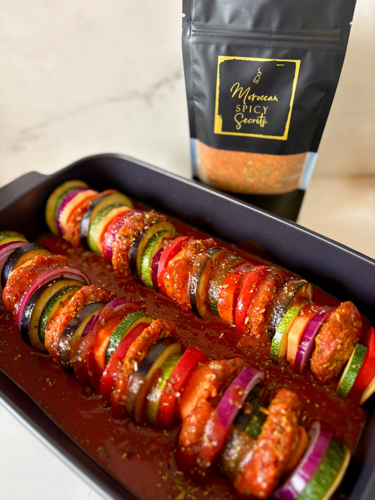 Ovenschotel met kefta, groenten en tomatensaus van Moroccan Spicy Secrets